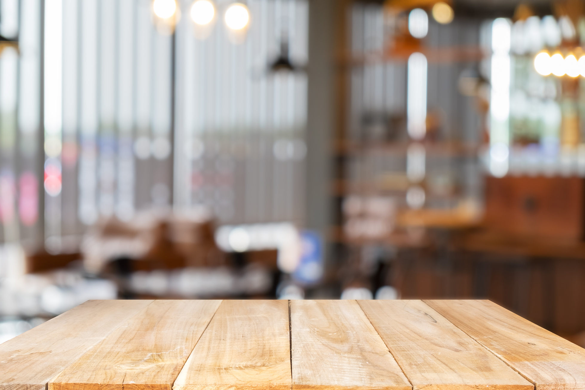 Empty Wooden Table on a Blurred Restaurant Background